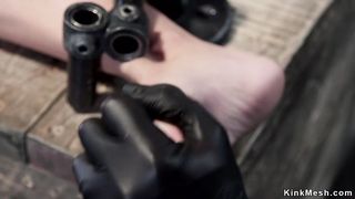 Helpless brunette in device bondage