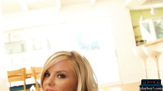 Curvy blonde MILF model strips naked