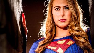 The blonde SuperGirl and a green monster