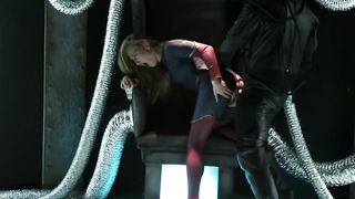 The blonde SuperGirl and a green monster