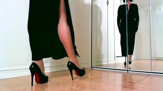 Sensual femdom teasing in shiny nylons