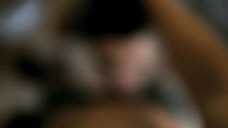 Tattooed green haired babe sucking a cock