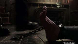 Busty slave is mummified and chained