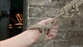 Redhead slave in pink knickers caned