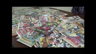 Real housewife strip teasing with comic books