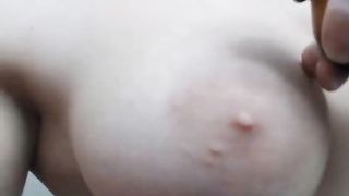 busty teen oils up her body