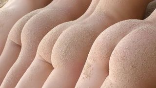 Four lesbian girlfriends on the beach