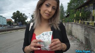 Pretty woman wearing a tiny red dress