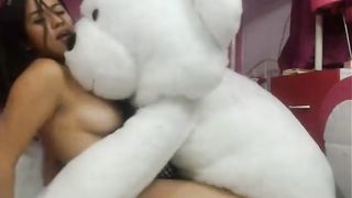 Naughty Latina playing with stuffed animal
