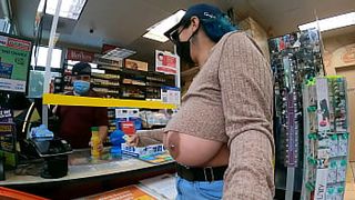 Woman pumps gas and pays cashier with her big tits out