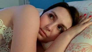 Stepmother and stepson share a bed in a hotel room.