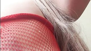 She has a sexy fishnet dress