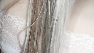 Susi as an sexy angel lying on bed with lush toy