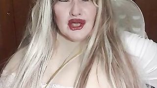 Susi as an sexy angel lying on bed with lush toy