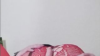 Susi teasing with toy in red fishnet