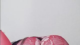 Susi teasing with toy in red fishnet