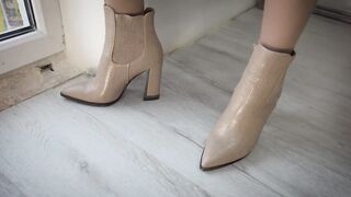 Sexy girl in stockings and boots has virtual sex through a video call